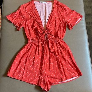 Red romper with white polka dots